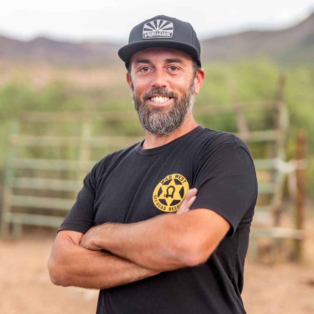 Employee Standing in Front of Wild West Off-Road Recovery Truck